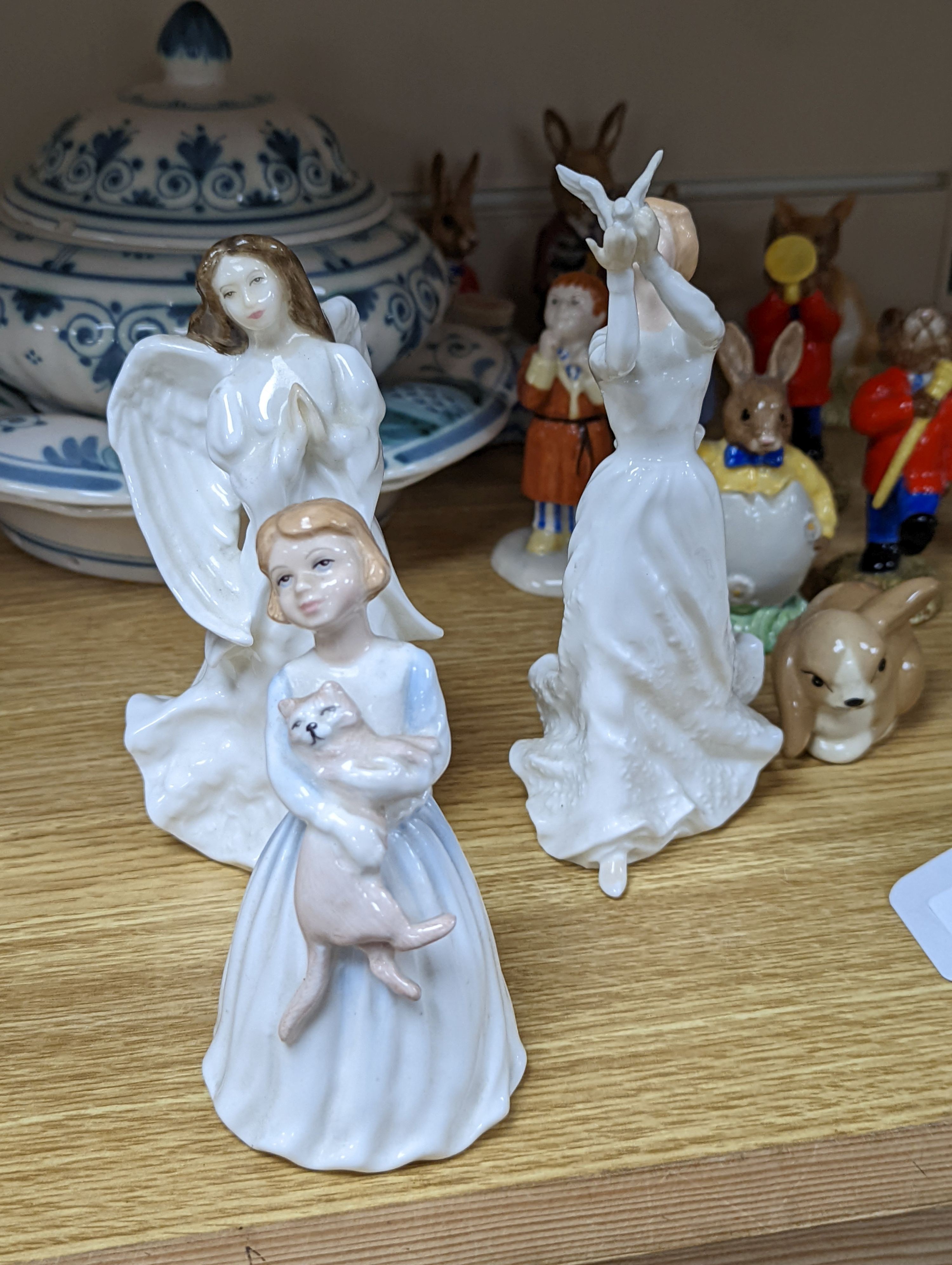 A collection of Royal Doulton figures including Bunnykins, a Doulton vase and other items